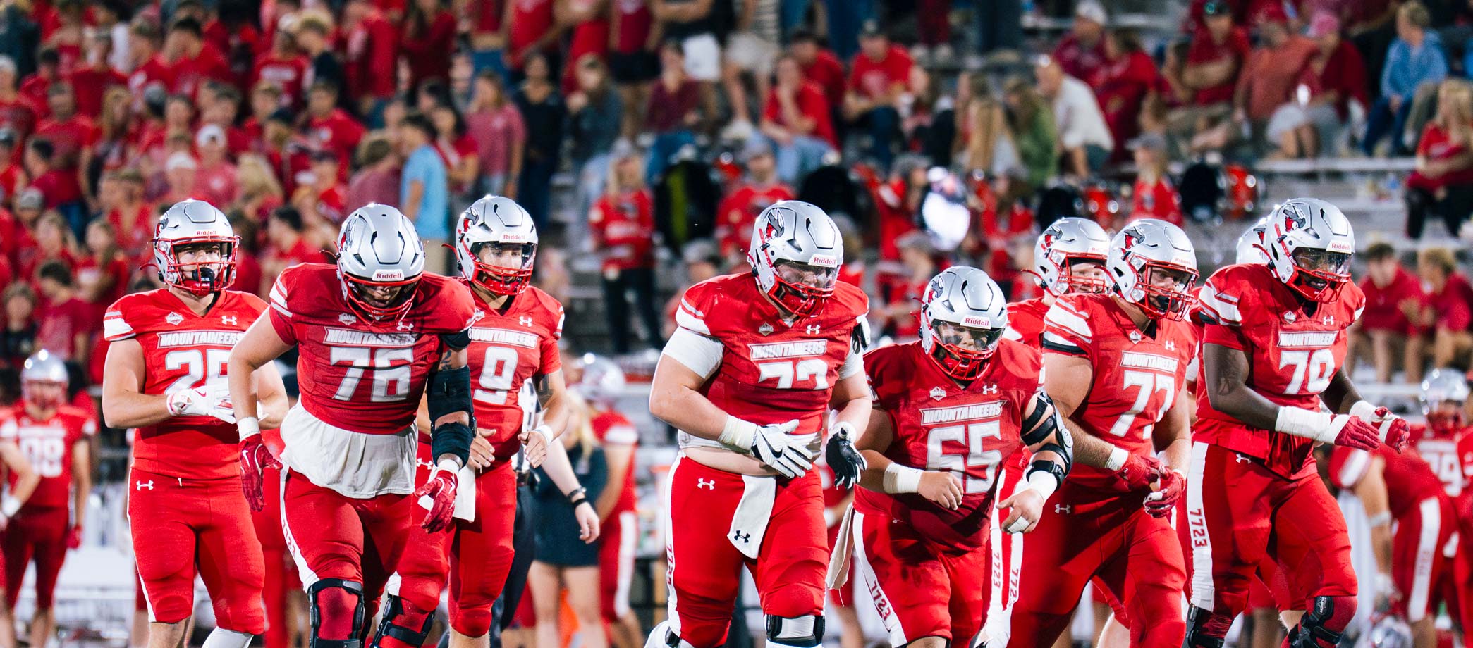 Western football players break to set up for a play during a game against West Texas A&M.