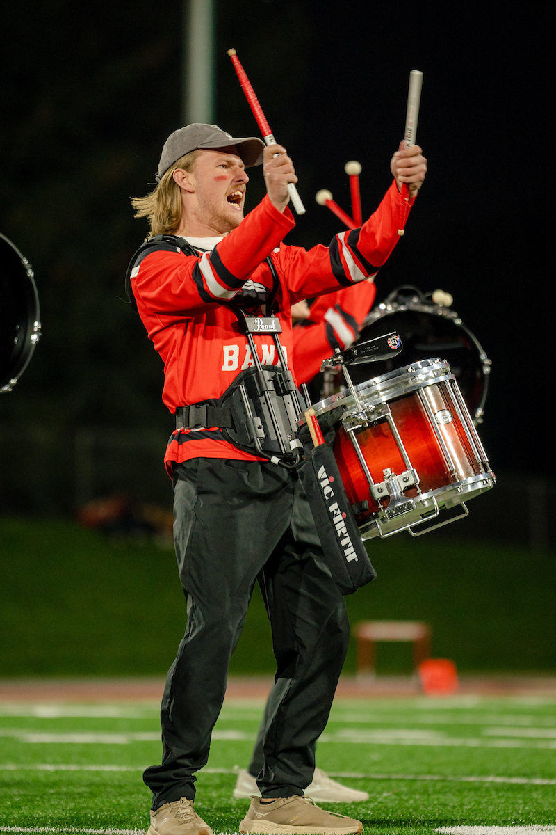 Western Snare drumline leader brings his drumstick together.