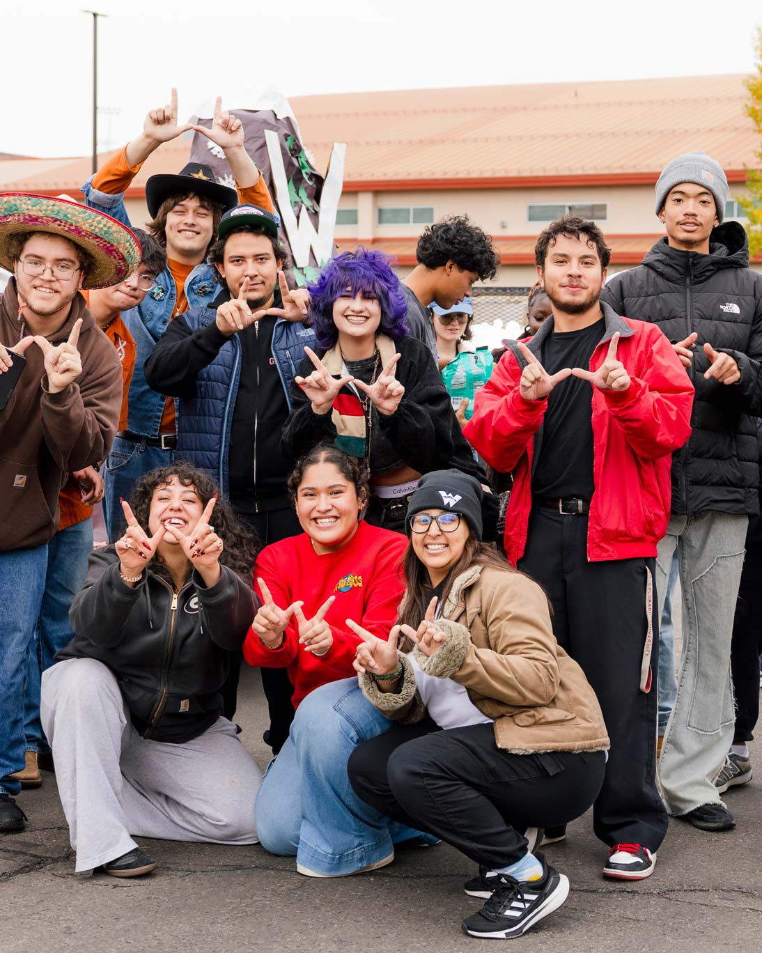 The Multicultural Center gathers for a group photo outside.