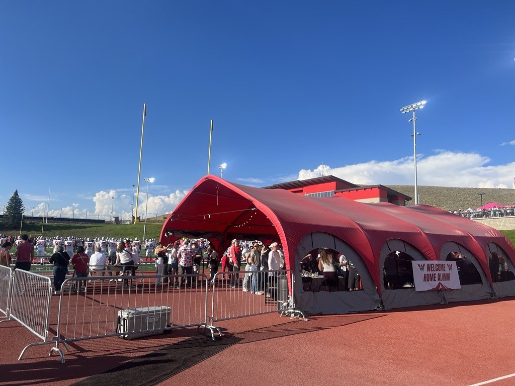 The alumni zone tent at the Mountaineer Bowl.