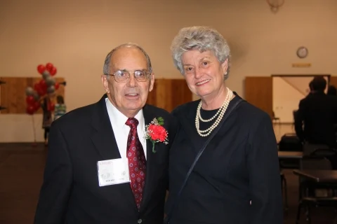 The Brattons smile at an event.